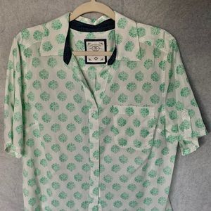 White blouse with green designs